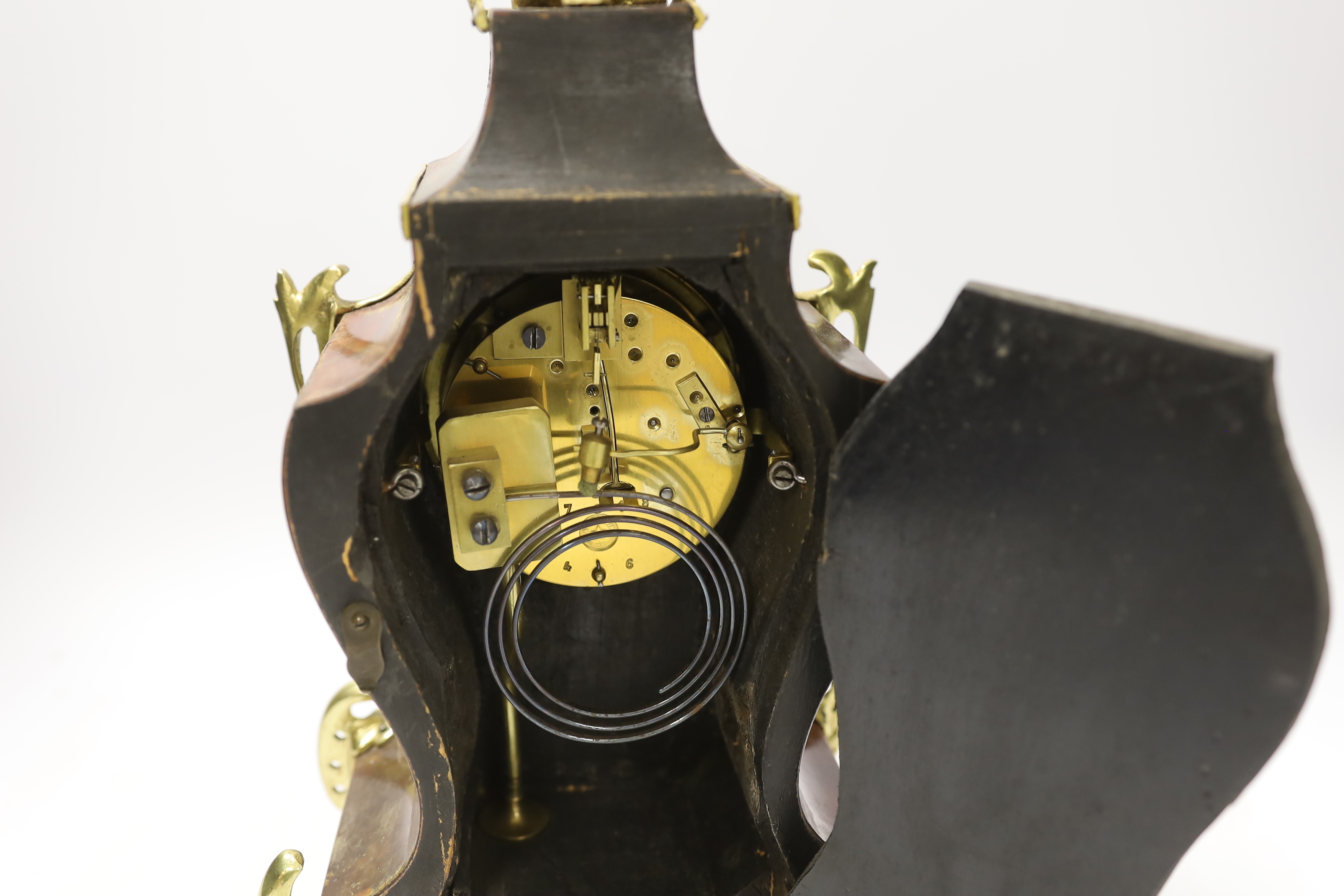 A Louis XV style tortoiseshell and ormolu mounted mantel clock with enamel Roman numeral dial, 35cm high